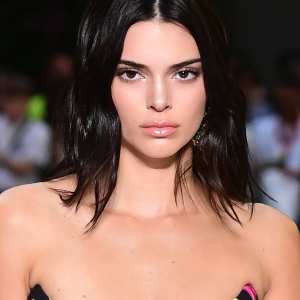 US model Kendall Jenner presents a creation by Versace during the men & women's spring/summer 2019 collection fashion show in Milan, on June 16, 2018. (Photo by MIGUEL MEDINA / AFP) (Photo credit should read MIGUEL MEDINA/AFP/Getty Images)