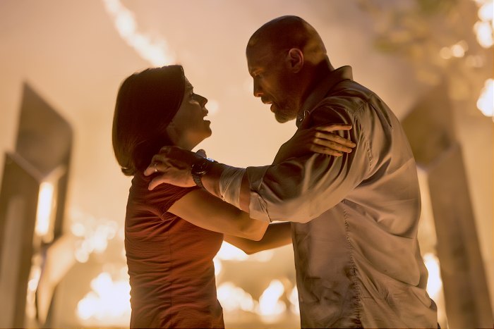 Neve Campbell and Dwayne Johnson in "Skyscraper"