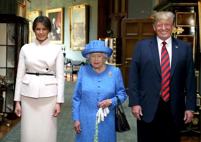 The Queen poses for a picture with US President Donald Trump and the First Lady, Melania Trump, in the Grand Corridor during their visit to Windsor Castle, Windsor.