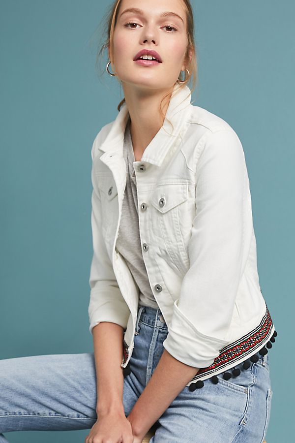white denim jacket with black tassels and embroidery