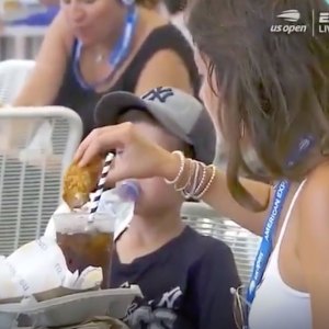 Woman Dips Chicken Tender in Soda
