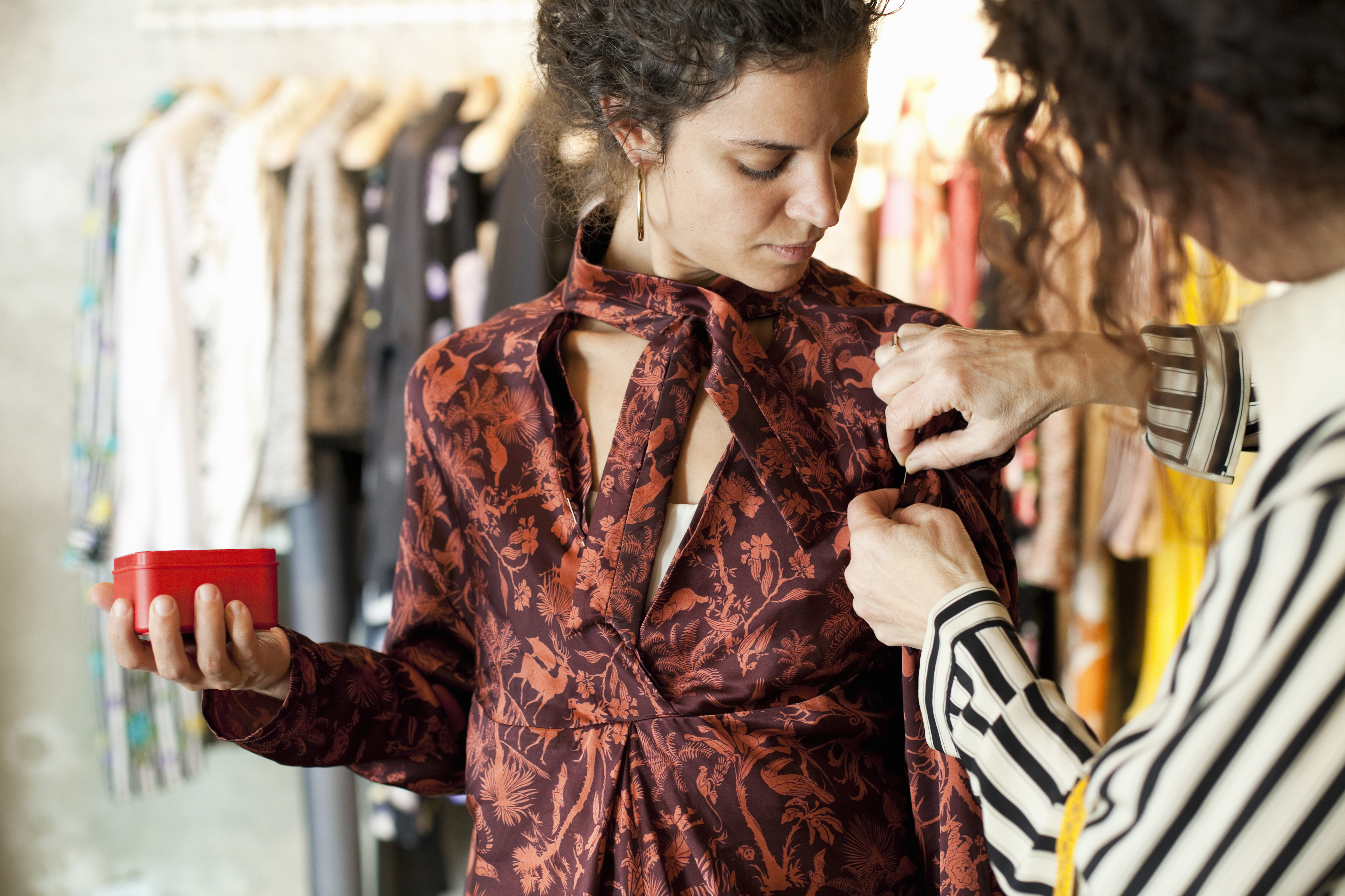 woman tailoring shirt