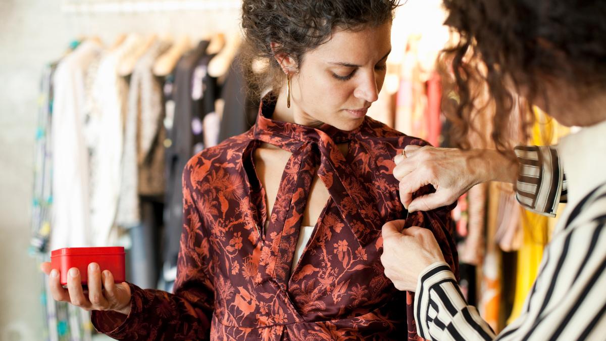 woman tailoring shirt
