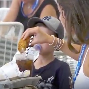 Woman Dips Chicken Tender in Soda