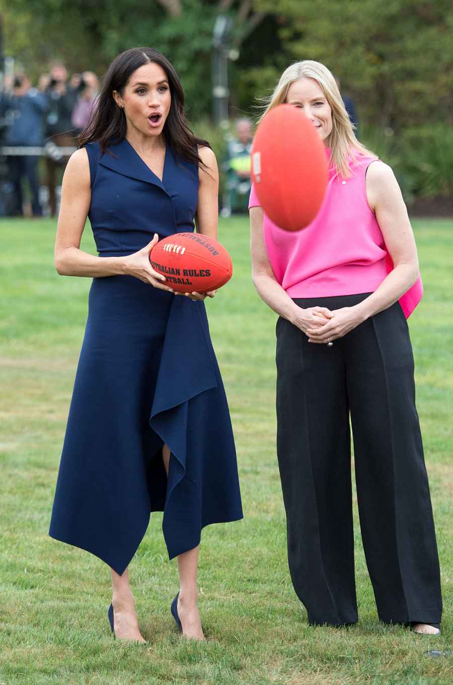 Pregnant Meghan Markle Plays Football