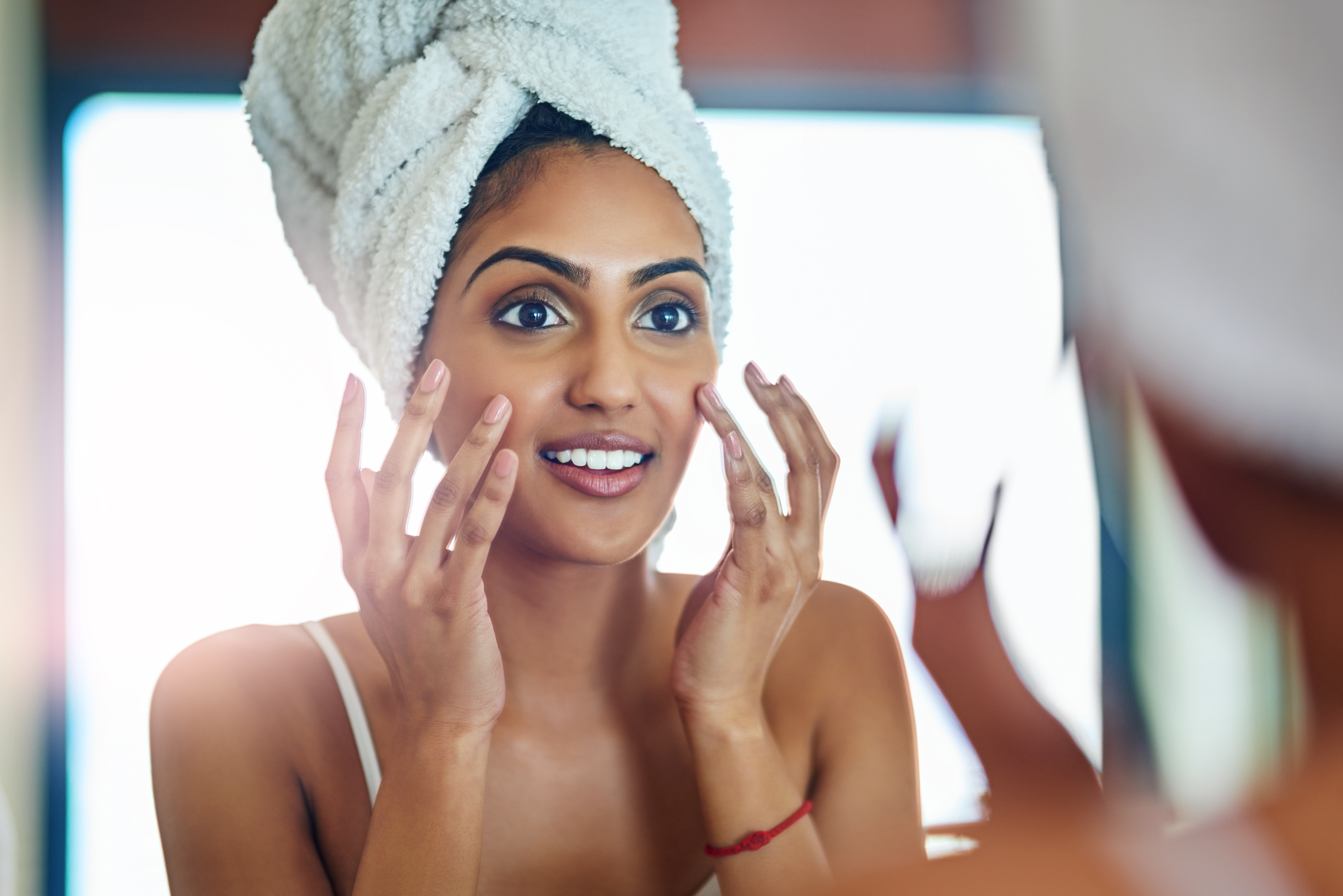 woman applying serum
