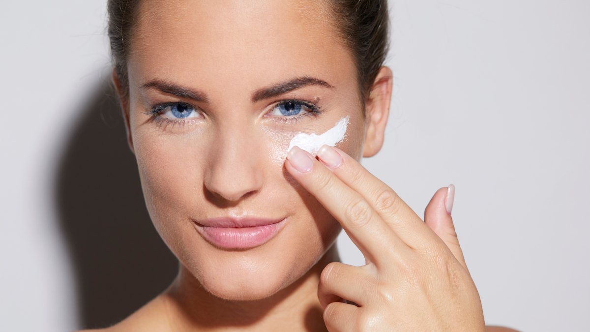 woman applying face cream