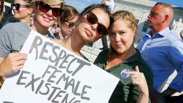 Emily Ratajkowski (C) and Amy Schumer (R) join the Brett Kavanaugh U.S. Supreme Court Confirmation Protest in front of the Supreme Court on October 4, 2018 in Washington, DC.
