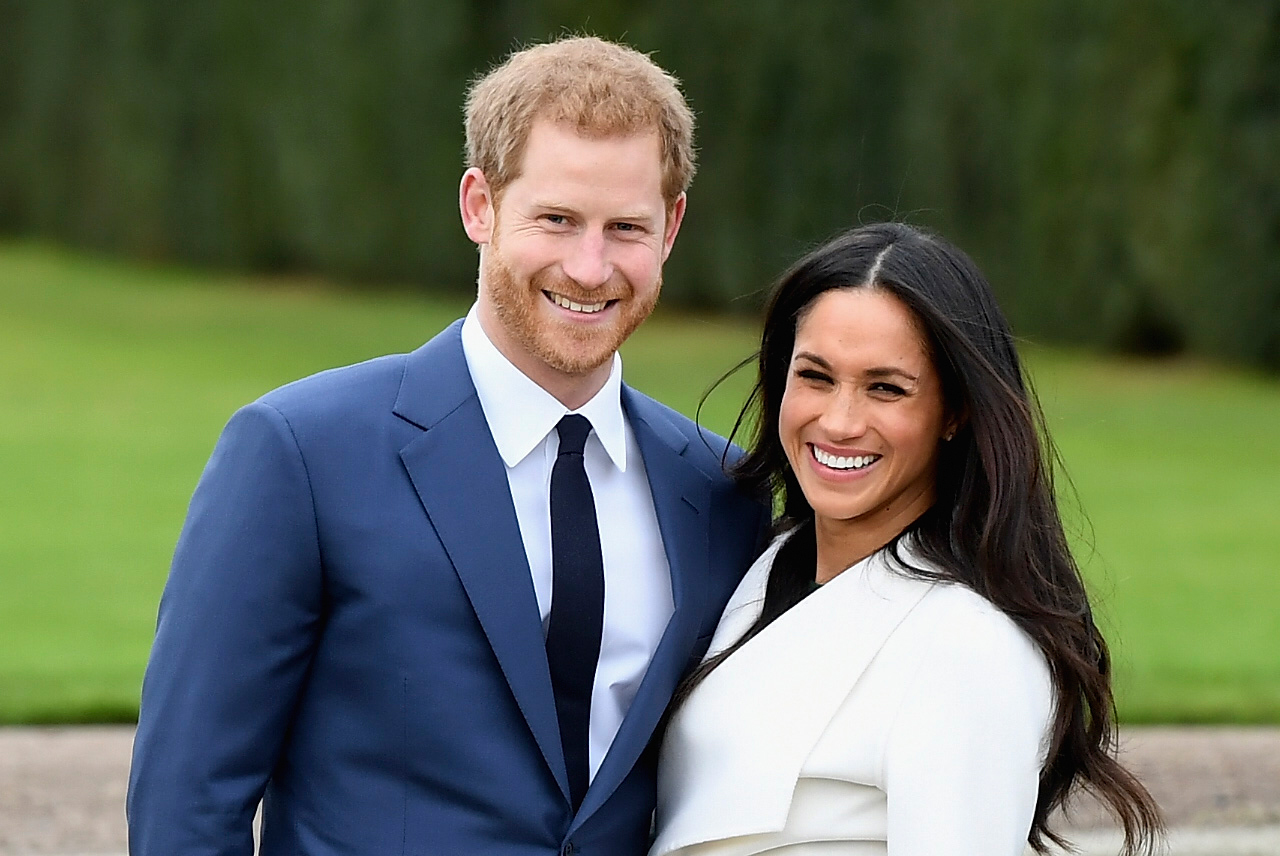 Prince Harry (L) and Meghan Markle