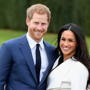 Prince Harry (L) and Meghan Markle
