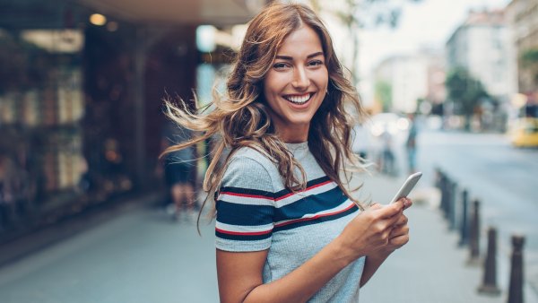 Beautiful city girl with smart phone