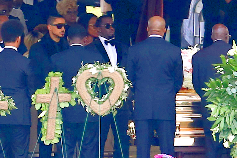 Sean Combs at Kim Porter's graveside.