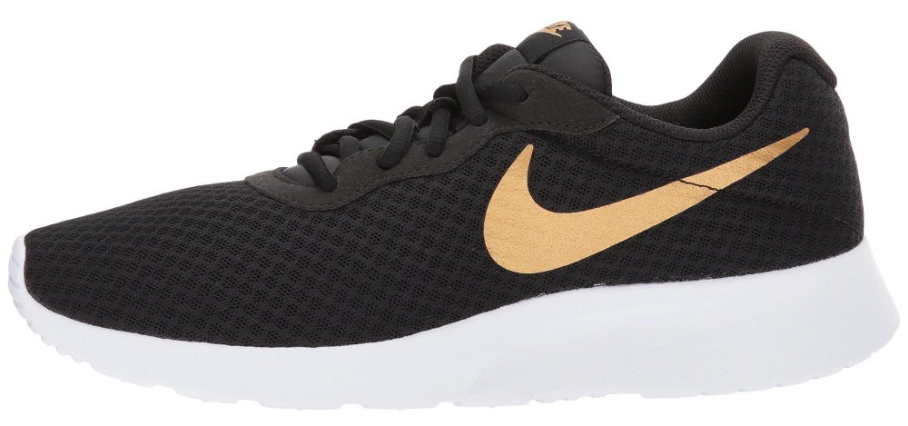 white black and gold nike sneaker