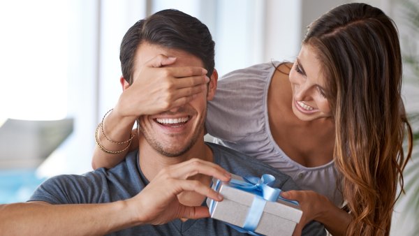 woman giving partner present