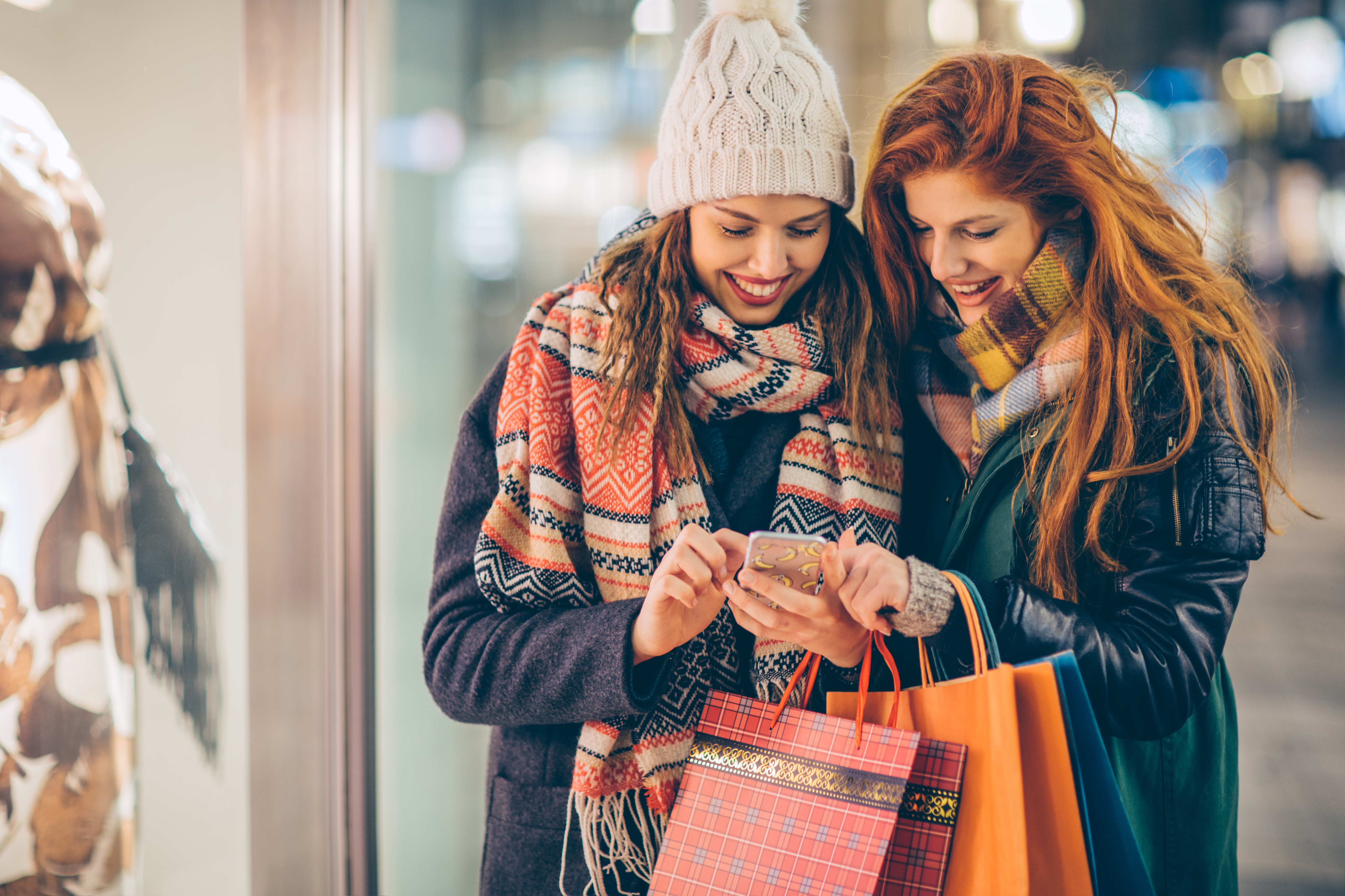 women with shopping bags