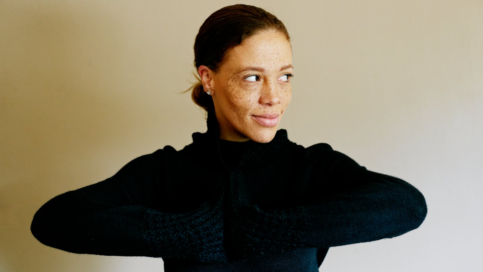 woman in turtleneck sweater