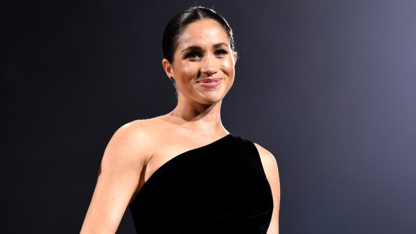 Pregnant Duchess Meghan Stuns in Black, Cradles Her Baby Bump at 2018 Fashion Awards: Pics