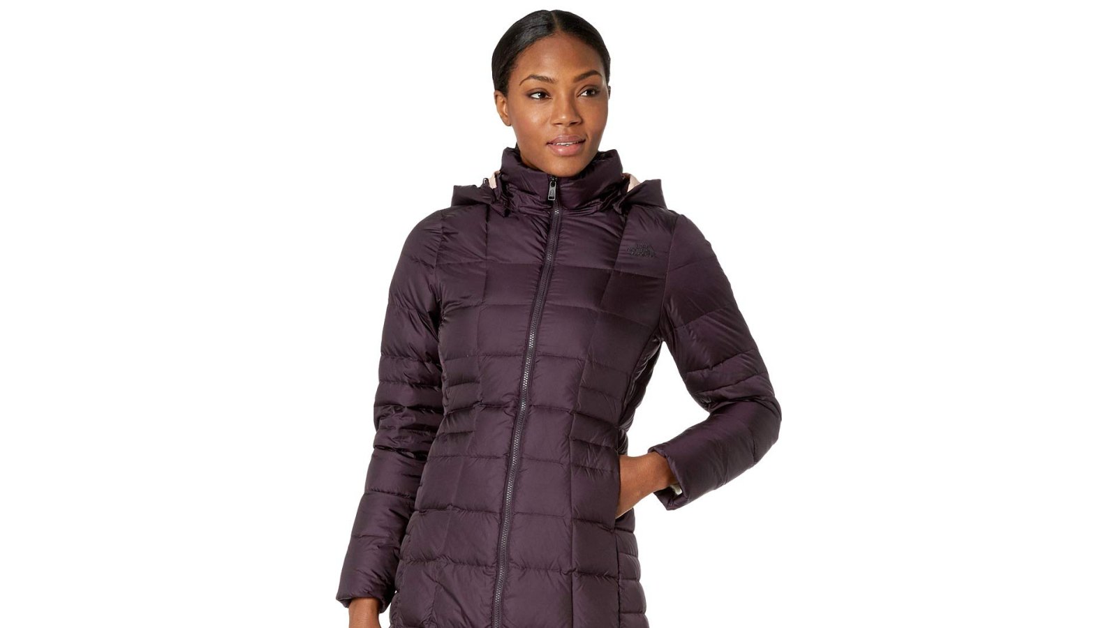 woman wearing a purple north face puffer coat