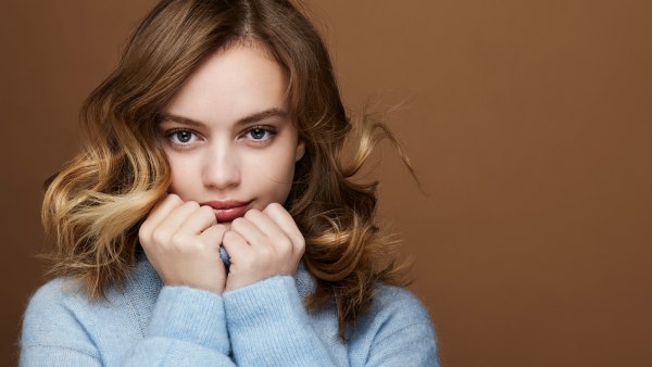 young woman in a blue outfit