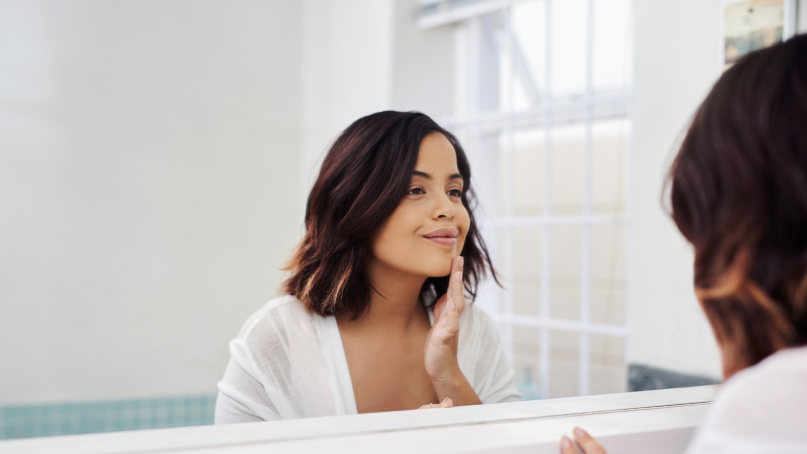 Woman applying skincare