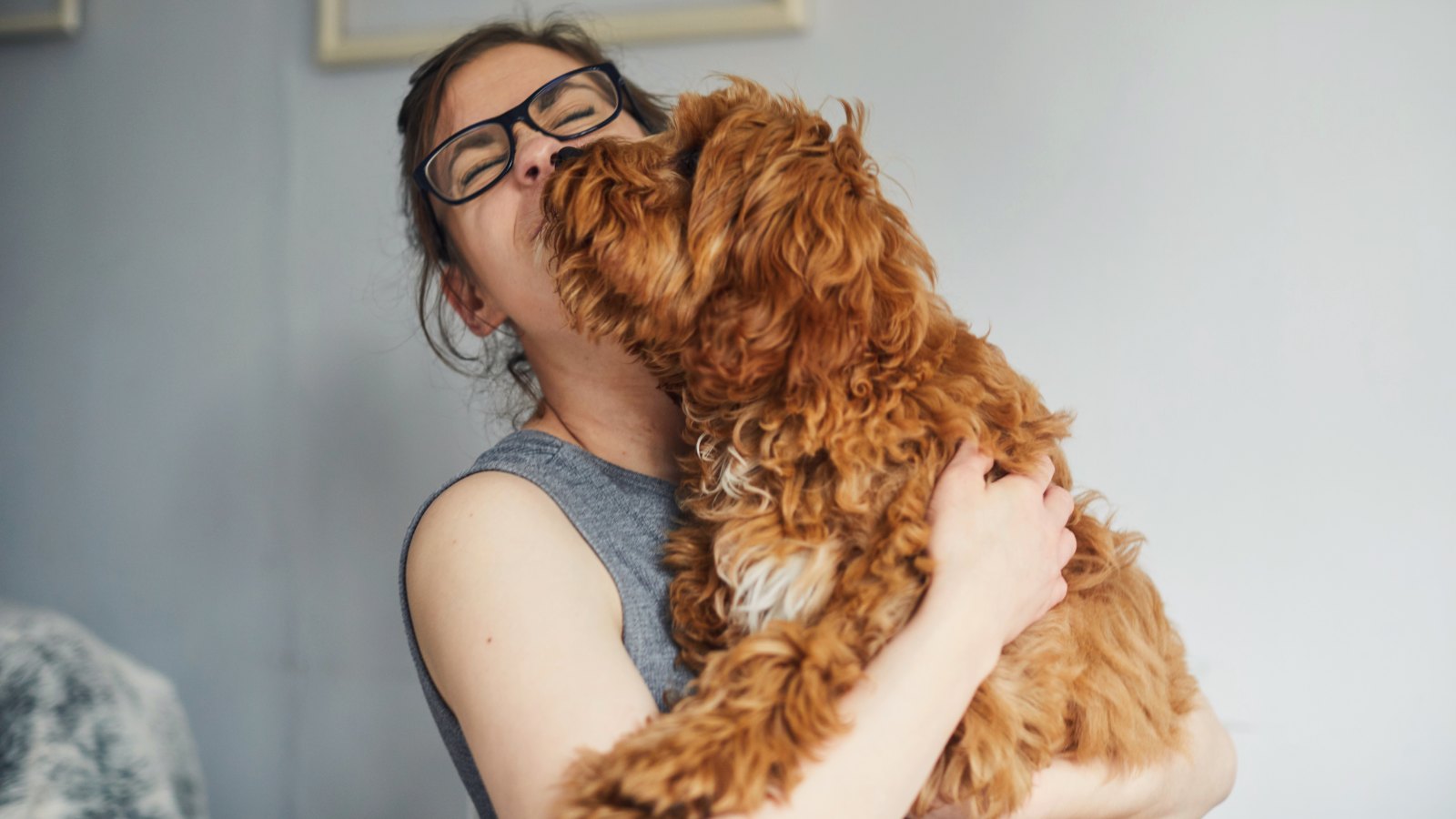 woman holding pet dog