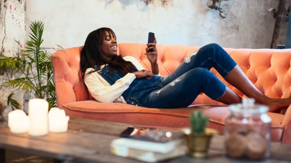 woman-on-couch-with-lit-candles