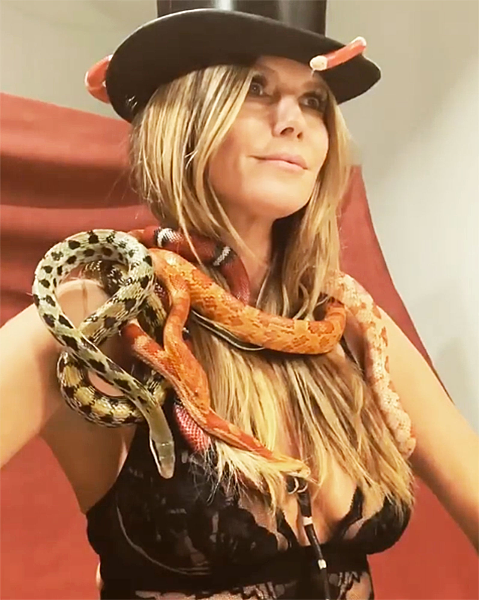 Heidi Klum Poses In Bra While Covered in Snakes