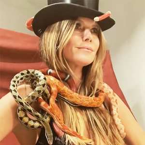Heidi Klum Poses In Bra While Covered in Snakes
