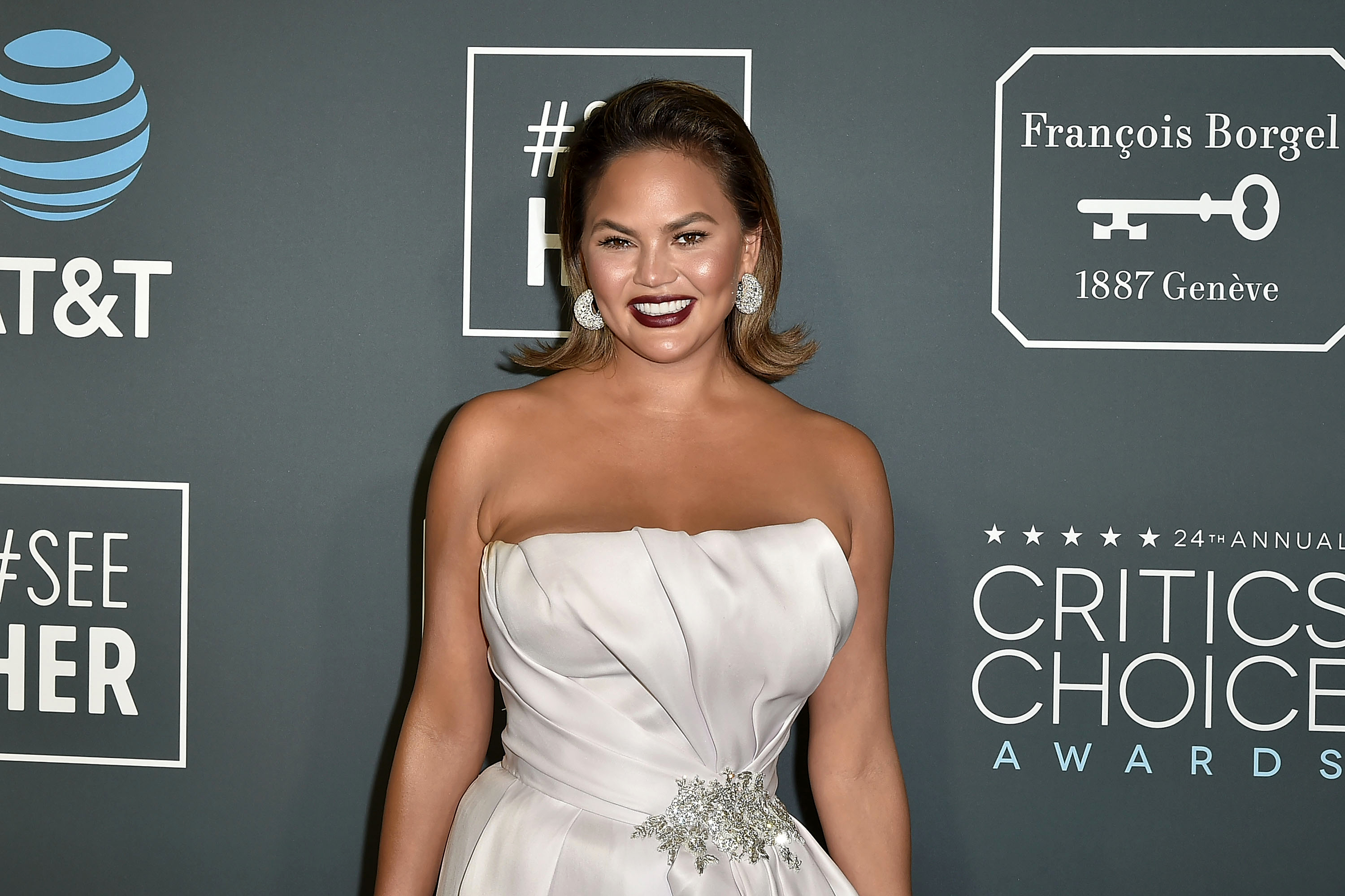 Chrissy Teigen Jokes She Shouldn’t Leave Her ‘Couch Corner’ After John’s Birthday