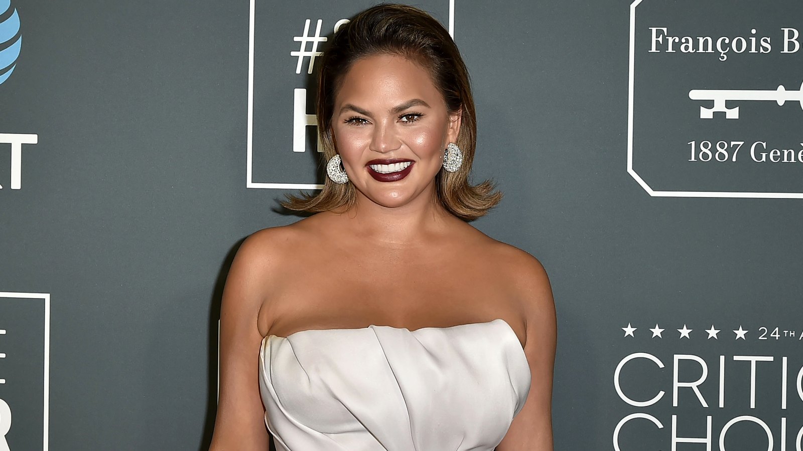 Chrissy Teigen Jokes She Shouldn’t Leave Her ‘Couch Corner’ After John’s Birthday