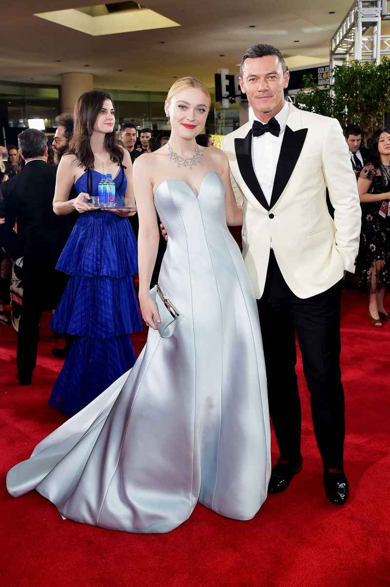 Dakota Fanning (L) and Luke Evans attend FIJI Water at the 76th Annual Golden Globe Awards