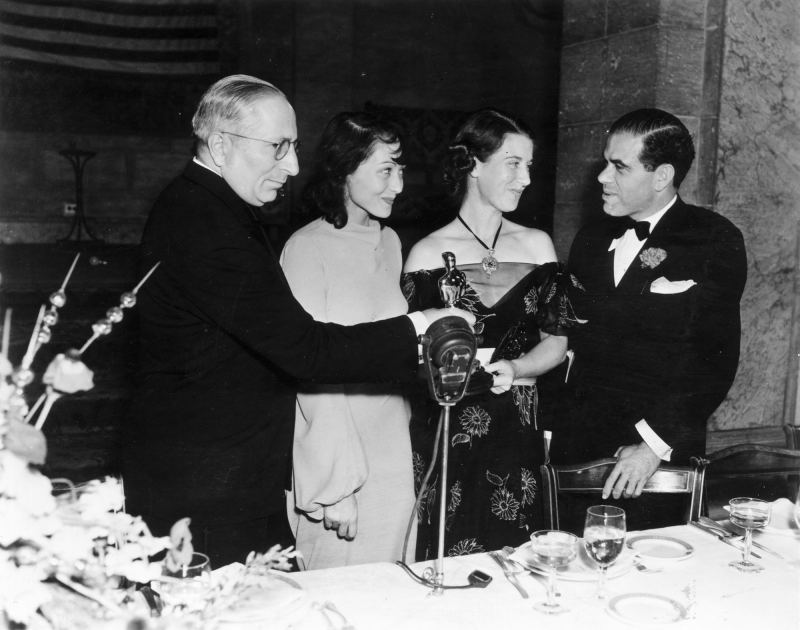 oscars fun facts March 1938: Luise Rainer at an Oscar Ceremony with Louis Mayer, Louise Tracy, wife of Spencer Tracy, and Frank Capra.
