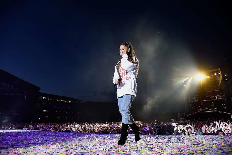 Ariana Grande wipes away a tear as she performs on stage during the One Love Manchester Benefit Concert at Old Trafford Cricket Ground on June 4, 2017 in Manchester, England.