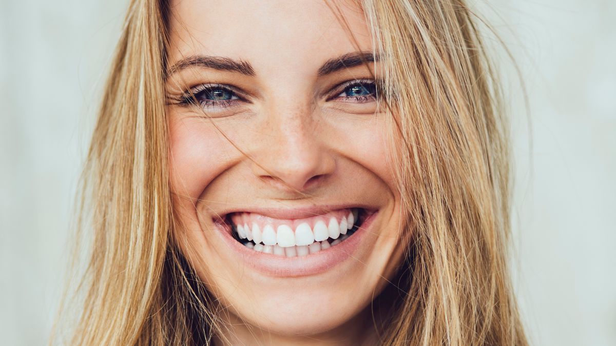 Portrait of young woman with beautiful smile