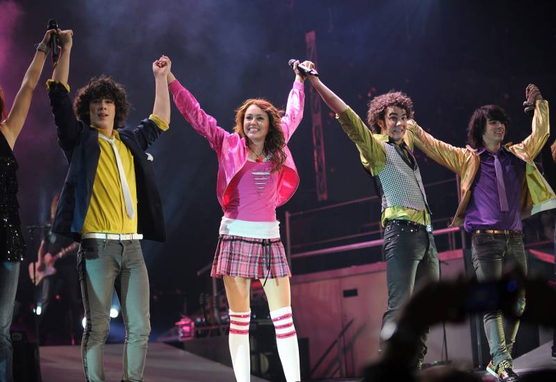 Relive the Highs and Lows of the Jonas Brothers’ Career: Breakup, Makeup and More Miley Cyrus performs with Nick Jonas, Kevin Jonas and Joe Jonas of Jonas Brothers