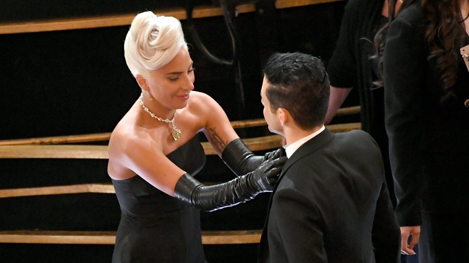 oscars 2019 Lady Gaga Fixes Fellow Nominee Rami Malek’s Tie at Oscars 2019