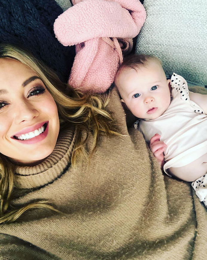 Hilary Duff cradles baby daughter Banks, seven months, during