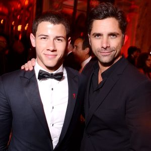 John Stamos Ups His Prank War With Nick Jonas By Tattooing His Face On His Arm