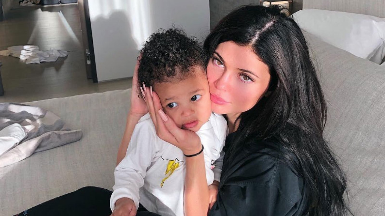 Kylie Jenner Shows Support for Travis Scott While Cuddling Stormi