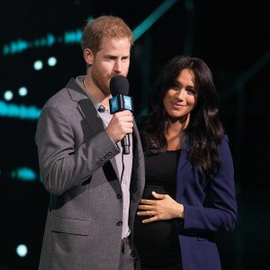 Prince Harry Surprises Crowd and Drags Pregnant Wife Duchess Meghan on Stage at Charity Event