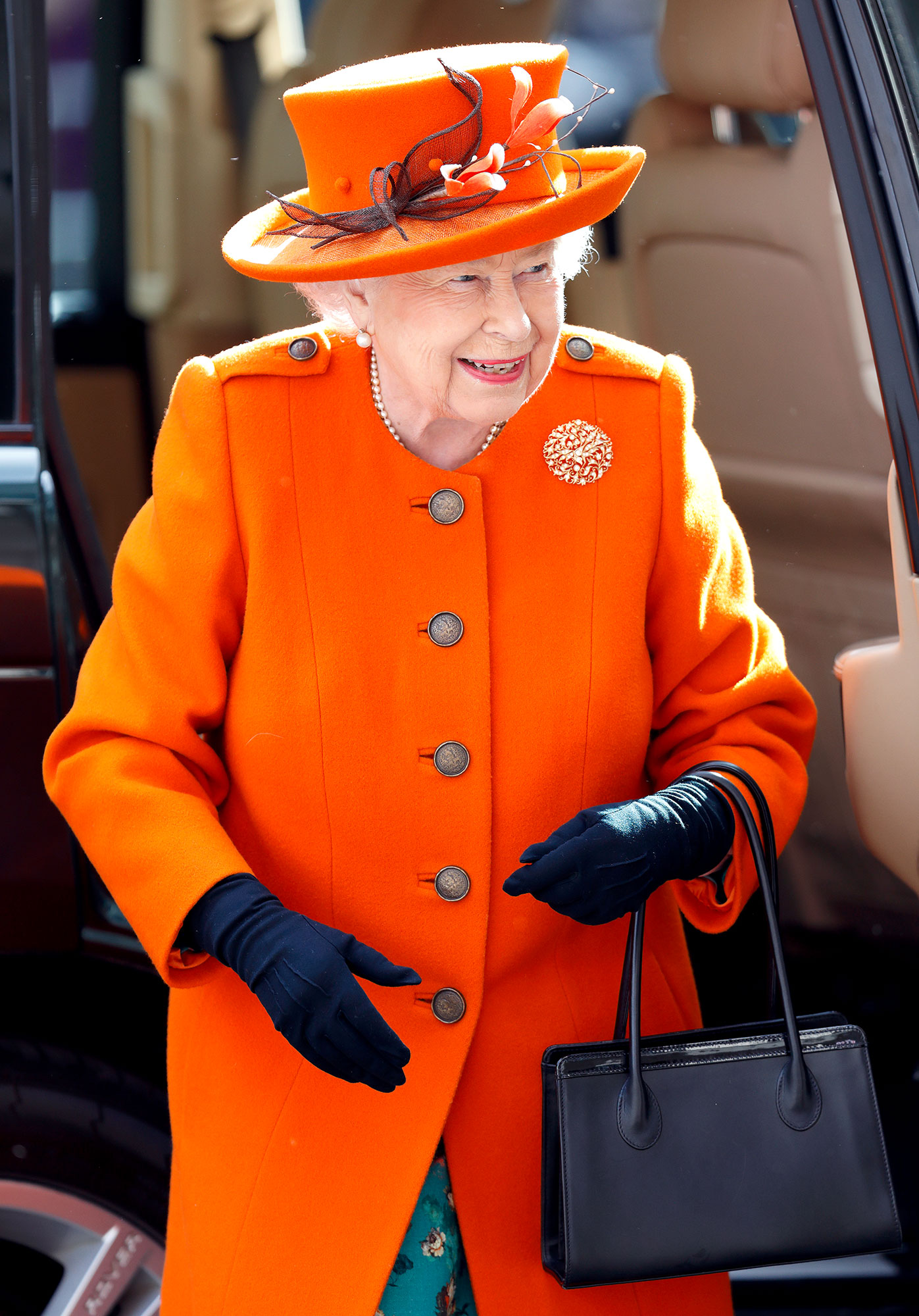 Royal fashion: Queen Elizabeth's black Launer handbag holds 52
