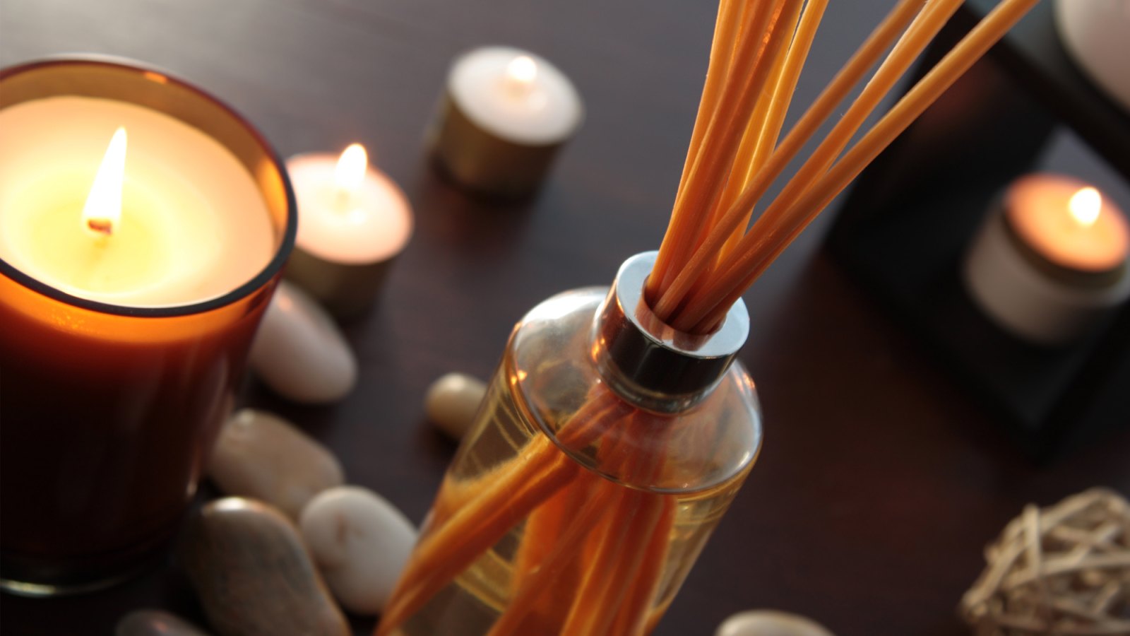 Close up of a bottle of fragrance diffuser with reeds.