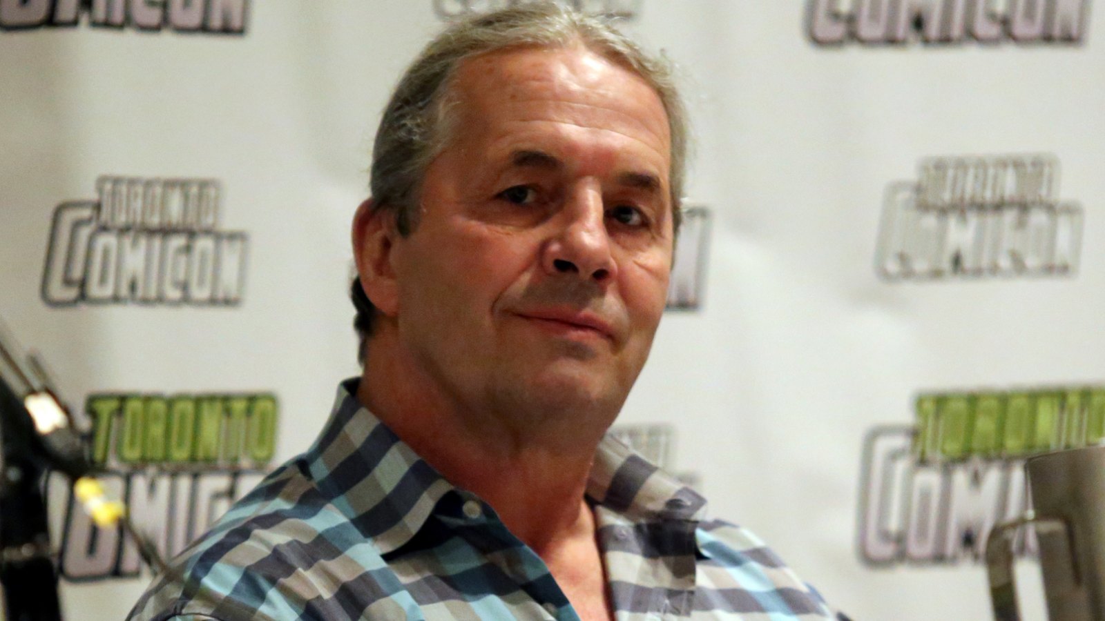 Wrestler Bret Hart Tackled By Fan Onstage at WWE Hall of Fame Ceremony