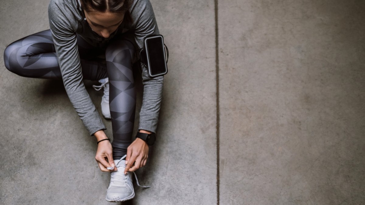 Young athlete jogging in underground garage
