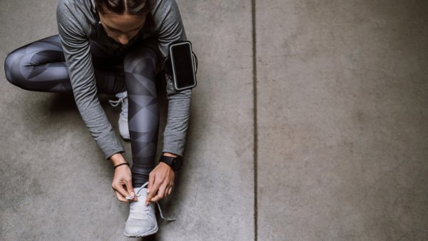 Young athlete jogging in underground garage