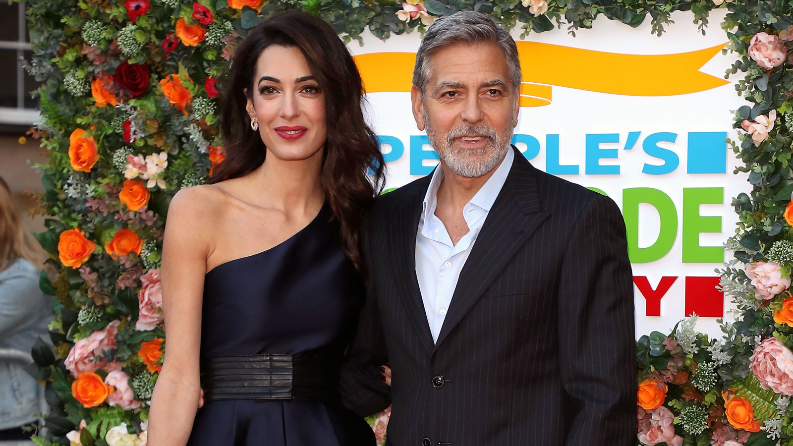 George Clooney Amal Clooney Off of Motorcycles People's Postcode Lottery Charity Gala