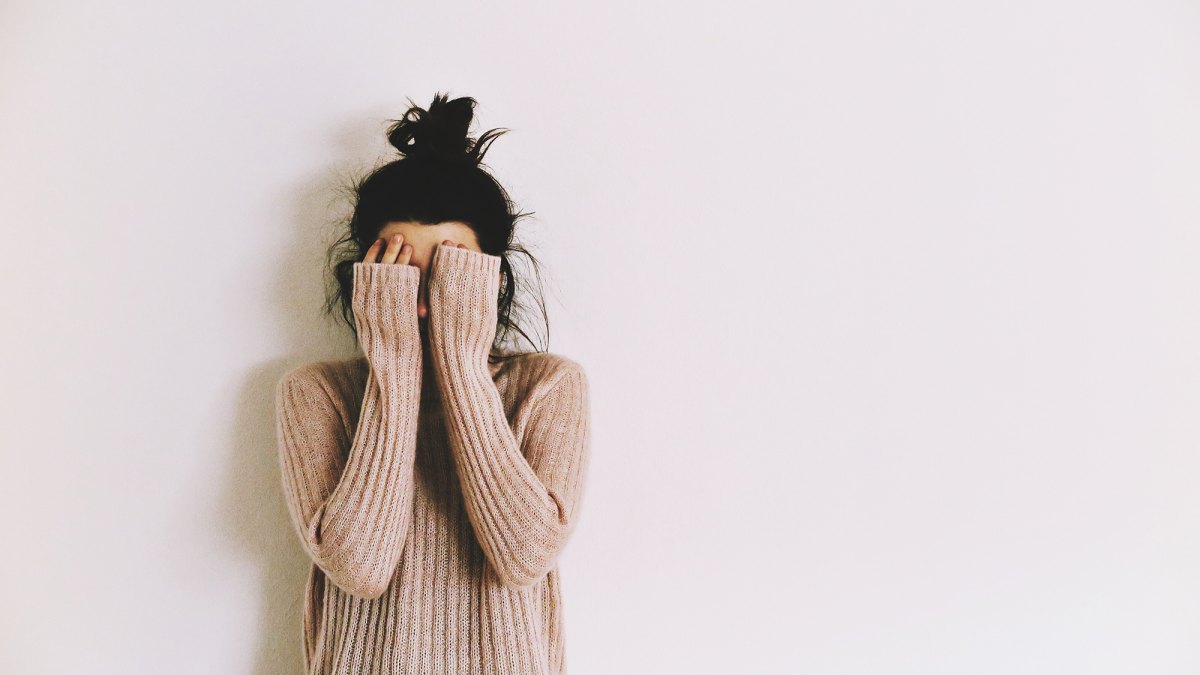 Woman Covering Face