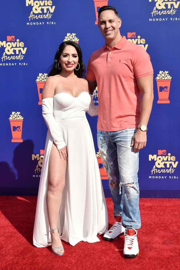 Angelina Pivarnick Wears A White Dress with Open Leg At MTV Video and TV Awards and Chris Larangeira Wears Sneakers, Ripped Jeans and a Polo Shirt