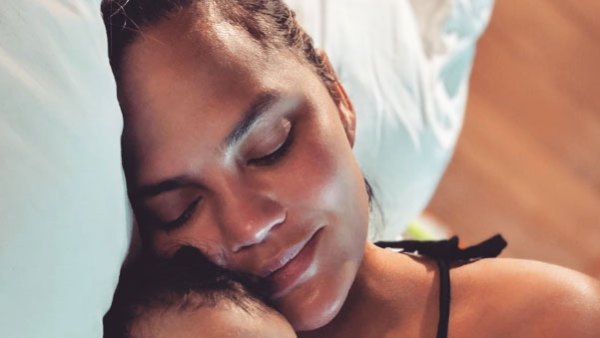 Chrissy Teigen and Miles Laying in Bed