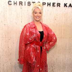 Erika Jayne Attends Christopher Kane's Party At Giorgio's Wearing A Long Red Jacket or Coat and Red Boots